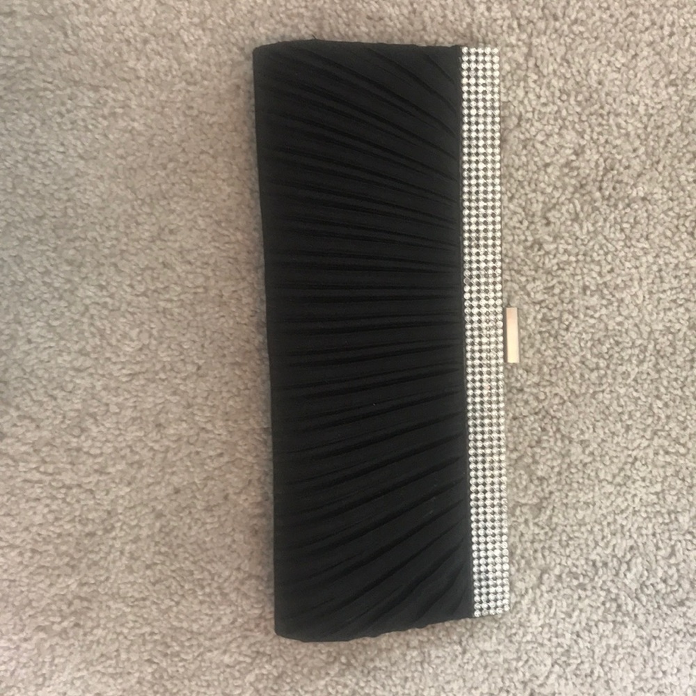 Black and sparkly clutch bag